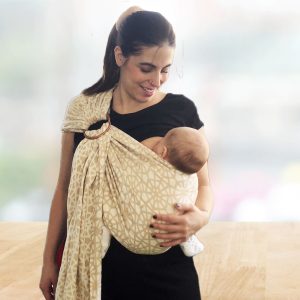 Mom breastfeeding newborn in sling carrier